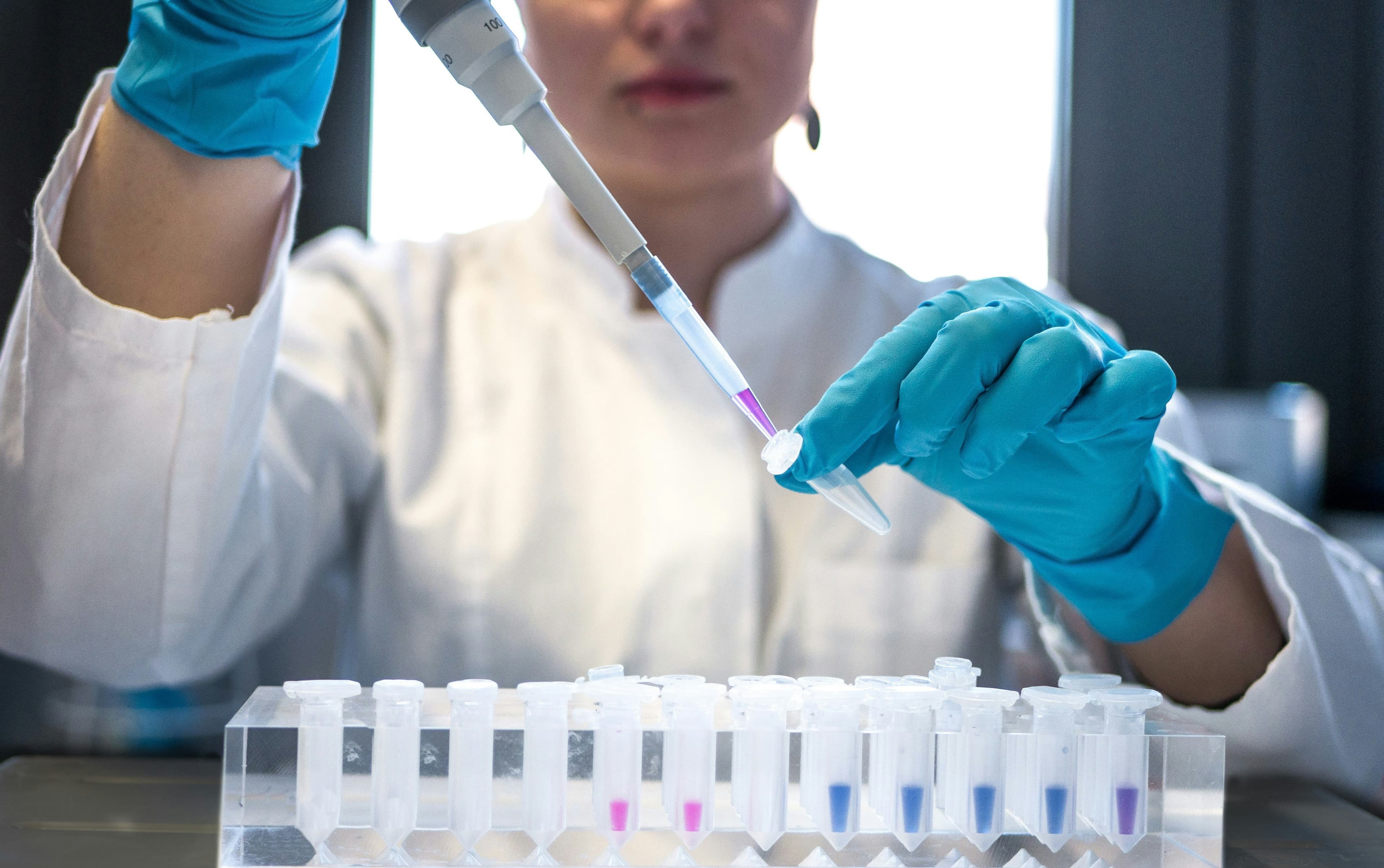 Scientist working with pipette